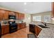 Bright kitchen featuring stainless appliances, granite counters, and generous cabinet space at 441 Mountain View Ln, Woodstock, GA 30188