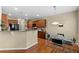 Eat-in kitchen featuring granite countertops, stainless steel appliances, and wooden cabinetry at 441 Mountain View Ln, Woodstock, GA 30188