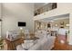 Bright living room boasts soaring ceilings, neutral decor, and hardwood floors at 441 Mountain View Ln, Woodstock, GA 30188