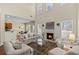 Spacious living room with fireplace, large windows, and comfortable seating area at 441 Mountain View Ln, Woodstock, GA 30188