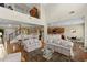 Open-concept living area with hardwood floors flowing into the kitchen and dining area at 441 Mountain View Ln, Woodstock, GA 30188