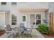 Back patio with a seating arrangement, offering a private outdoor space at 441 Mountain View Ln, Woodstock, GA 30188