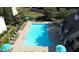 Community pool with lounge chairs and umbrellas for relaxing by the water at 441 Mountain View Ln, Woodstock, GA 30188