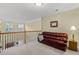 Bright sitting area with leather sofa, carpet and natural light from windows at 441 Mountain View Ln, Woodstock, GA 30188