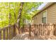 Large wooden deck and steps looking out onto mature trees and foliage at 1045 Summer Hill Nw Ct, Acworth, GA 30102