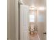 Bright bathroom features a toilet, window, and vanity sink with updated fixtures at 1045 Summer Hill Nw Ct, Acworth, GA 30102