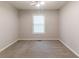 Comfortable bedroom featuring neutral paint, plush carpet, and ample natural light at 1045 Summer Hill Nw Ct, Acworth, GA 30102
