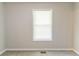 Well-lit room featuring neutral walls, soft carpet, and a window allowing for natural light at 1045 Summer Hill Nw Ct, Acworth, GA 30102