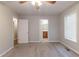 Spacious bedroom provides access to the ensuite bathroom with large window and soft carpet at 1045 Summer Hill Nw Ct, Acworth, GA 30102