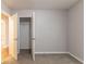Spacious bedroom featuring neutral walls, soft carpet, and a walk-in closet for ample storage at 1045 Summer Hill Nw Ct, Acworth, GA 30102