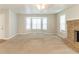 Inviting living room with large bay windows and stone fireplace at 1045 Summer Hill Nw Ct, Acworth, GA 30102