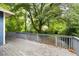 Spacious back deck overlooking a lush, green backyard surrounded by mature trees at 120 Warren Ne St, Atlanta, GA 30317