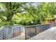 Spacious back deck overlooking the yard, with stairs leading down to the green space at 120 Warren Ne St, Atlanta, GA 30317