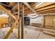 Unfinished basement with exposed brick and beams, and concrete floor at 120 Warren Ne St, Atlanta, GA 30317