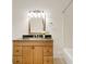 Bathroom featuring granite countertops, wood cabinetry and tile flooring at 120 Warren Ne St, Atlanta, GA 30317