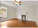 Bedroom featuring hardwood floors, a fireplace, a ceiling fan and a window with natural light at 120 Warren Ne St, Atlanta, GA 30317
