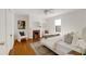 Bright bedroom with a fireplace, hardwood floors, and stylish decor at 120 Warren Ne St, Atlanta, GA 30317
