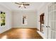Bedroom with hardwood floors, a fireplace, a ceiling fan and a bright window offering natural light at 120 Warren Ne St, Atlanta, GA 30317