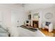 Bedroom featuring a cozy fireplace, two chairs, and neutral decor at 120 Warren Ne St, Atlanta, GA 30317