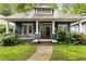 Charming home with a welcoming front porch and beautiful landscaping at 120 Warren Ne St, Atlanta, GA 30317