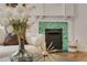 Close-up of a fireplace with colorful tiles and decorative items at 120 Warren Ne St, Atlanta, GA 30317