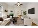 Cozy living room featuring a fireplace, ceiling fan, and comfortable seating arrangement at 120 Warren Ne St, Atlanta, GA 30317