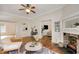 Cozy living room with a decorative fireplace, hardwood floors, and open layout at 120 Warren Ne St, Atlanta, GA 30317