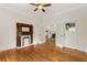 Spacious living room with wood floors, a fireplace and french doors leading to an adjacent room at 120 Warren Ne St, Atlanta, GA 30317
