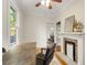 Bright office with hardwood floors, a fireplace, a ceiling fan and large windows offering natural light at 120 Warren Ne St, Atlanta, GA 30317