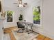 Office featuring hardwood floors, large windows with a view, a modern chair and a decorative fireplace at 120 Warren Ne St, Atlanta, GA 30317