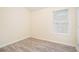 This bedroom features hardwood floors and natural light from a window with blinds at 2722 South Hills, Riverdale, GA 30296