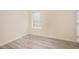 This bedroom features hardwood floors and natural light from a window with blinds at 2722 South Hills, Riverdale, GA 30296
