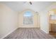 Bright bedroom features wood-look floors, a ceiling fan, and a vaulted ceiling with an arched window at 2722 South Hills, Riverdale, GA 30296