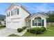 Charming two-story home featuring a two-car garage and neatly manicured lawn at 2722 South Hills, Riverdale, GA 30296