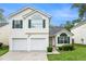 Charming two-story home featuring a two-car garage and neatly manicured lawn at 2722 South Hills, Riverdale, GA 30296