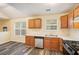 Well-lit kitchen with wood cabinets, stainless appliances, and stone countertops at 2722 South Hills, Riverdale, GA 30296