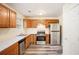 Bright kitchen featuring stainless steel appliances, wood cabinets, and modern countertops at 2722 South Hills, Riverdale, GA 30296
