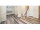 Bright living room with beautiful floors, wainscoting, and staircase at 2722 South Hills, Riverdale, GA 30296