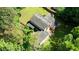 Overhead photo displaying home, spacious yard, and surrounding mature trees at 2926 Swarthmore Dr, Lawrenceville, GA 30044