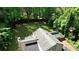 This high-angle view features a home with mature trees and a large yard in a private setting at 2926 Swarthmore Dr, Lawrenceville, GA 30044