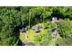 Aerial view of property showcasing the house, lawn, landscaping, trees and surrounding neighborhood at 2926 Swarthmore Dr, Lawrenceville, GA 30044