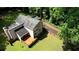 An aerial view of the property, highlighting the home, its wooden deck, and the surrounding greenery at 2926 Swarthmore Dr, Lawrenceville, GA 30044