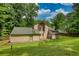 Backyard featuring a lush lawn showcasing the home's exterior with a patio and deck at 2926 Swarthmore Dr, Lawrenceville, GA 30044