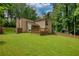Green lawn and wooden deck create a relaxing outdoor space in this beautiful backyard at 2926 Swarthmore Dr, Lawrenceville, GA 30044