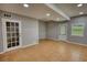 Spacious finished basement with tiled floors, recessed lighting, and multiple access points at 2926 Swarthmore Dr, Lawrenceville, GA 30044