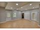 Large basement with recessed lighting, tile floors, multiple windows, and sliding door access at 2926 Swarthmore Dr, Lawrenceville, GA 30044