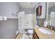 Cozy bathroom featuring a tiled shower, vanity with granite counter, and stylish fixtures at 2926 Swarthmore Dr, Lawrenceville, GA 30044