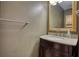 Well-lit half-bathroom with vanity and granite countertop at 2926 Swarthmore Dr, Lawrenceville, GA 30044