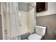 Bathroom featuring a shower-tub and toilet at 2926 Swarthmore Dr, Lawrenceville, GA 30044