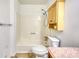 Bathroom featuring a shower-tub combination, light wood cabinet, and standard toilet at 2926 Swarthmore Dr, Lawrenceville, GA 30044